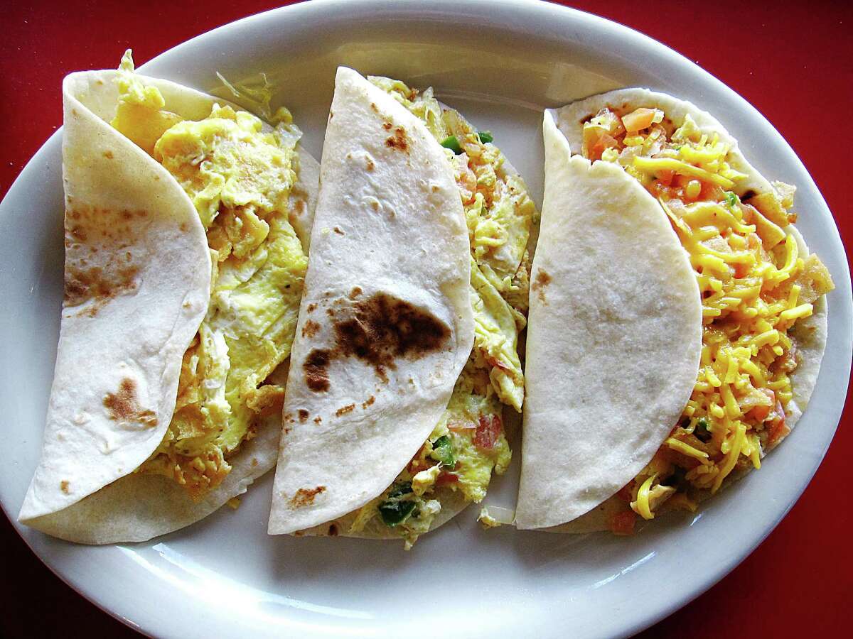 Breakfast tacos on handmade flour tortillas, from left: migas, eggs a la mexicana and chilaquiles from Molino Rojo Cafe.