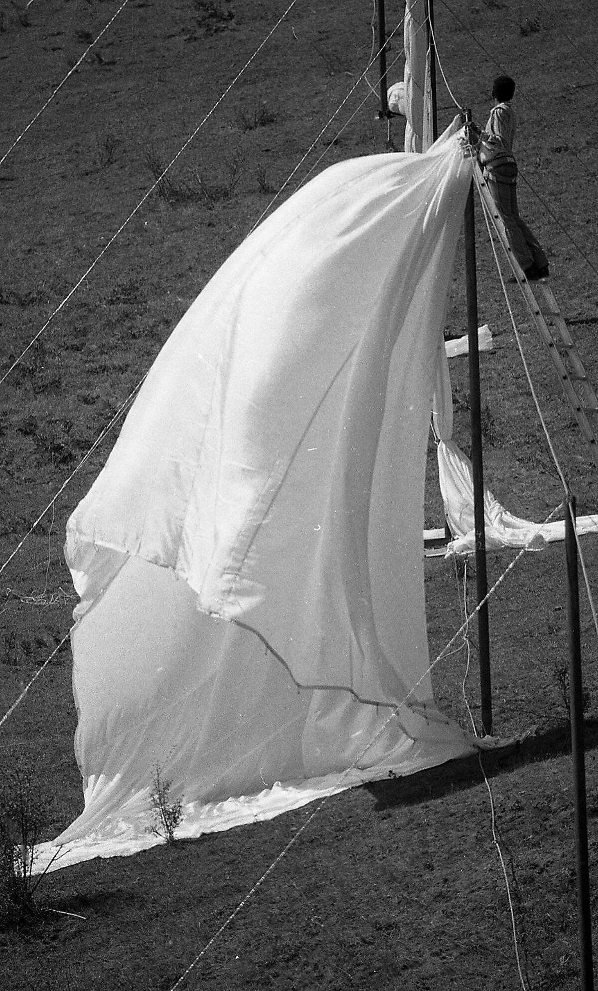 New York artist Christo Javacheff's a 24 mile long running fence being installed from Petaluma to the Pacific Ocean, September 8, 1976