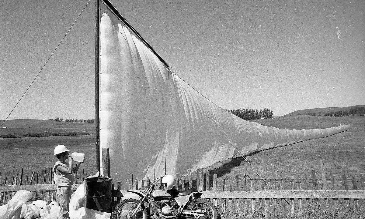 New York artist Christo Javacheff's a 24 mile long running fence being installed from Petaluma to the Pacific Ocean, September February 8, 1976