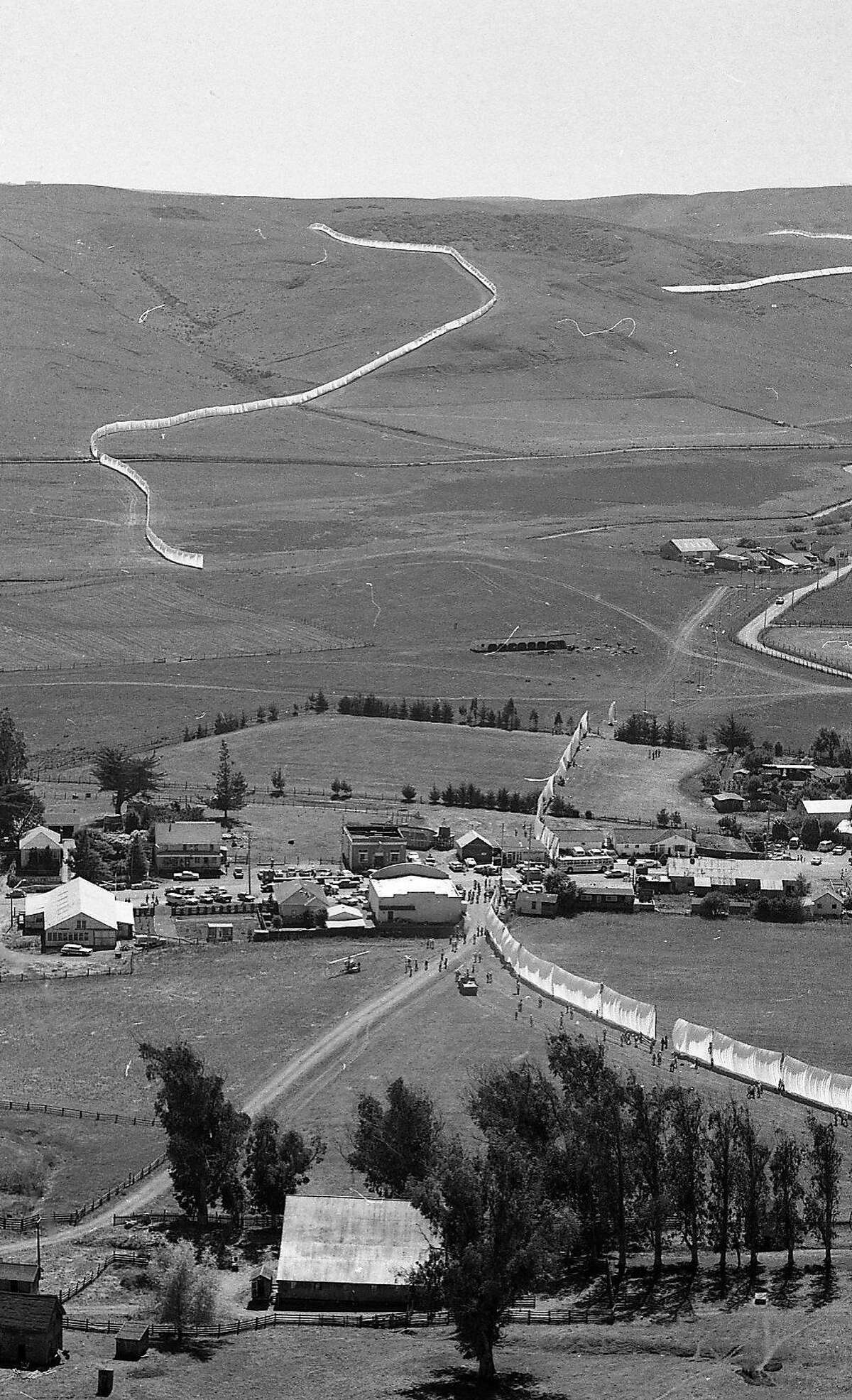 Aerial photos of Christo installing his 24 mile long running fence through Sonoma County, September 8, 1976