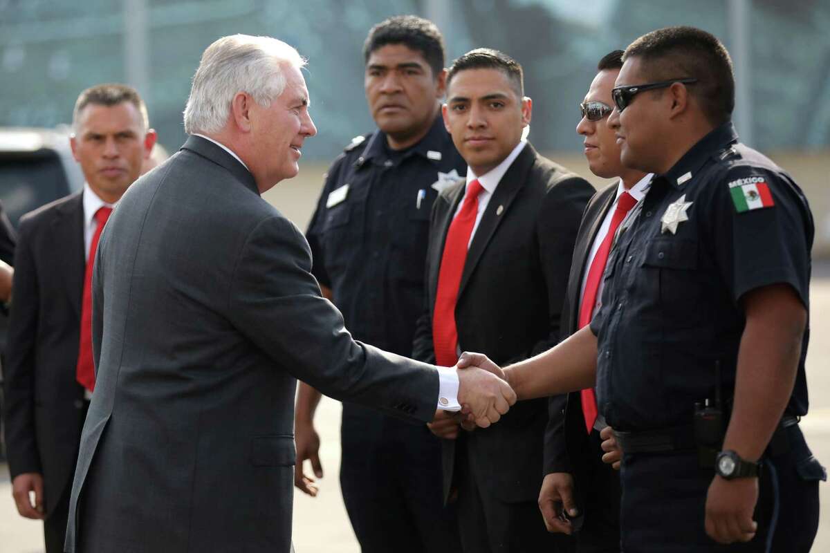 U.S. Secretary of State Rex Tillerson (L) shakes hands with police officers and security personnel as he departs from the Benito Juarez international Airport following a recent meeting in Mexico City. A reader wonders if trade will suffer under the Trump administration.