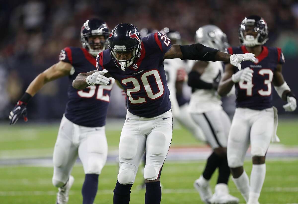 Houston Texans defensive back Don Jones (20) celebrates after stopping Oakland Raiders defensive back SaQwan Edwards (30) as he attempted a punt return during the fourth quarter of an NFL playoff game at NRG Stadium, January 7, 2017. ( Karen Warren / Houston Chronicle )