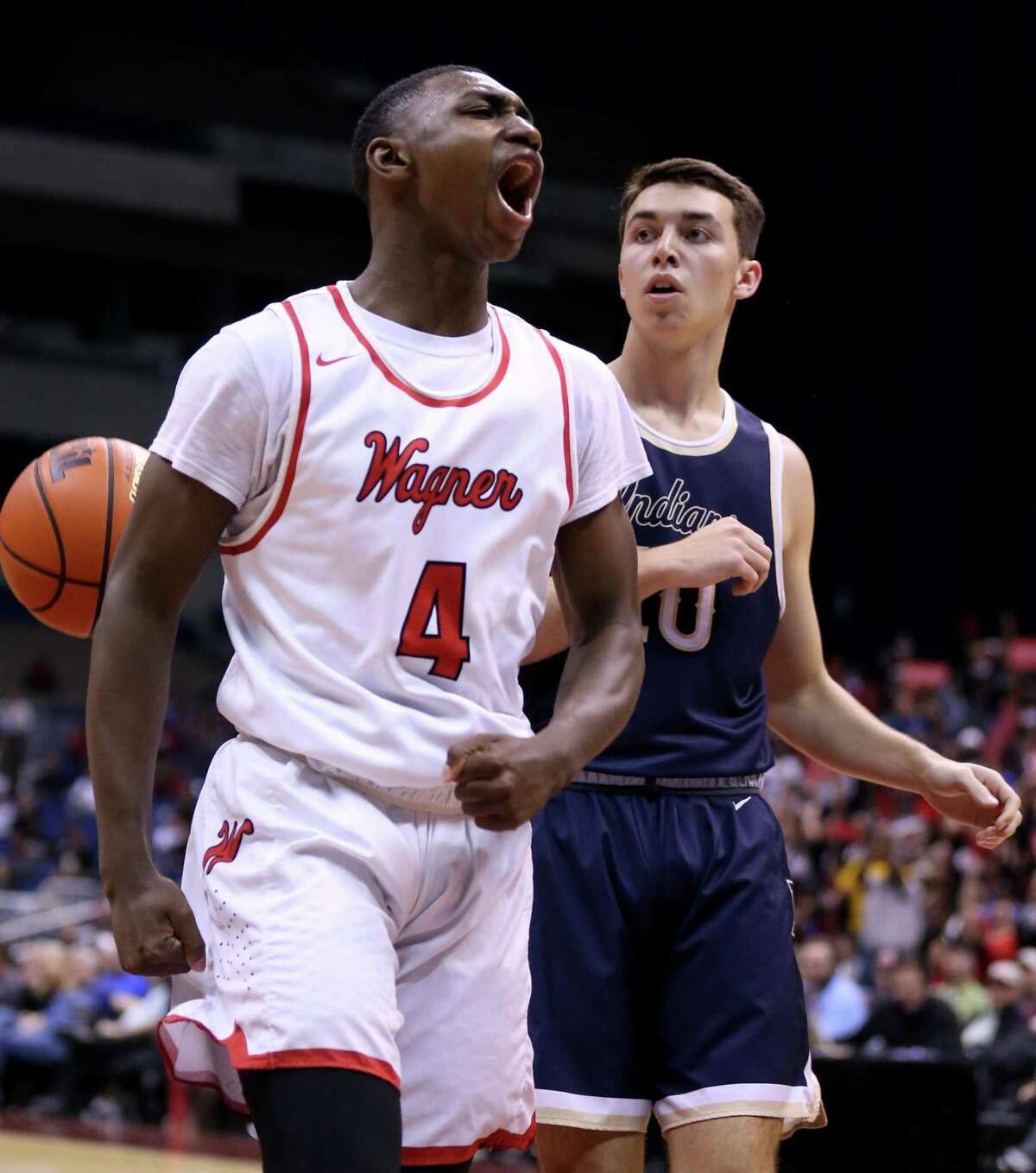 Wagner?•s Jalen Jackson reacts after a play as Keller?•s Jackson Hataway looks on during first half action of their Class 6A state semifinal game held Friday March 10, 2017 at the Alamodome.