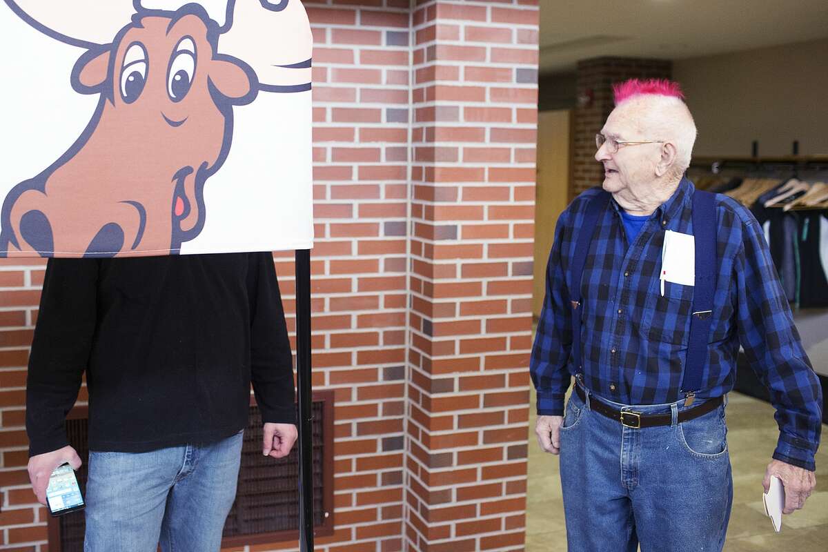 George Harrell, of Beaverton, speaks with Gerry Clark, from the radio station 94.5, the Moose, before participating in the Walk for Warmth at the Midland Community Center on Saturday.