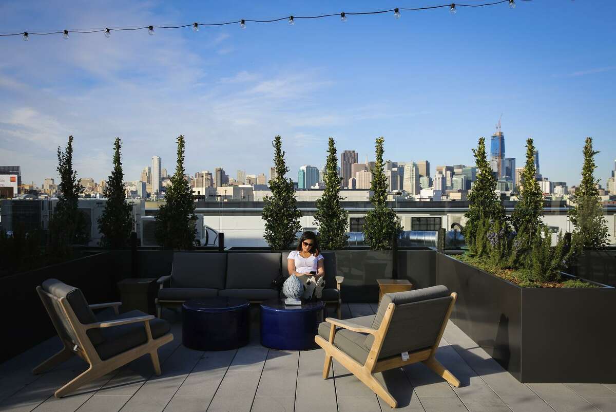 Above: Stormy Brown relaxes on the deck at the One Henry Adams complex in S.F.’s Showplace Square neighborhood in the Design District. Below: The 1010 16th St. project on the edge of Potrero Hill.