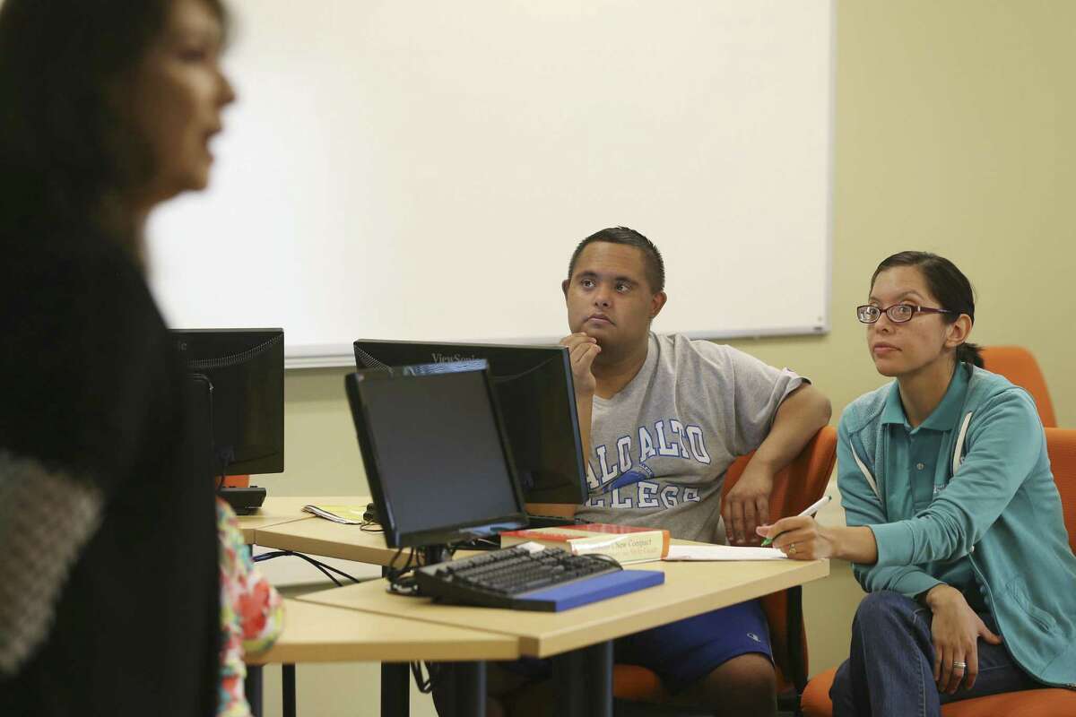 Steven Lopez, 24, listens as business instructor Sylvia de Hoyos, left, goes over material during a final exam review for the Project Access course at Palo Alto College, Thursday, March 9, 2017. The pilot program is currently preparing seven students with intellectual disabilities to earn an administrative assistant certification. Sitting with Lopez is work study student, Nicole Ramiez.