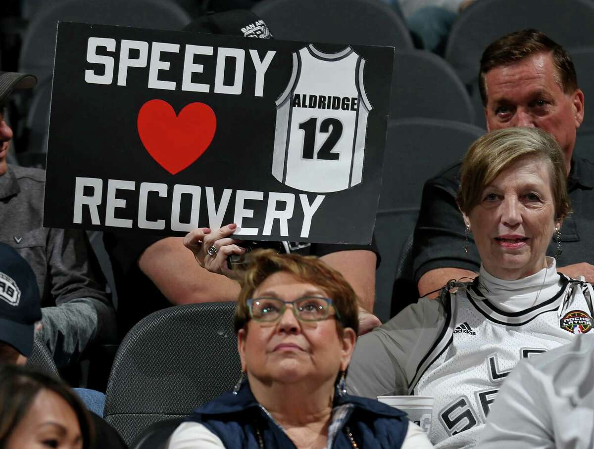 A Spurs fan holds a sign for LaMarcus Aldridge before the game with the Golden State Warriors Saturday March 11, 2017 at the AT&T Center.