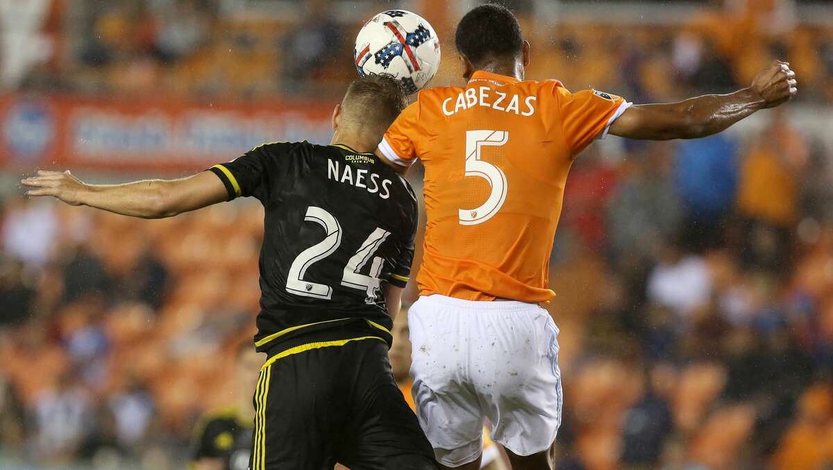 Columbus Crew defender Nicolai Naess (24) and Houston Dynamo midfielder Juan Cabezas (5) goes up for a header during the second half of the MLS soccer game at BBVA Compass Stadium Saturday, March 11, 2017, in Houston. The Dynamos defeated the Crew 3-1. ( Yi-Chin Lee / Houston Chronicle )