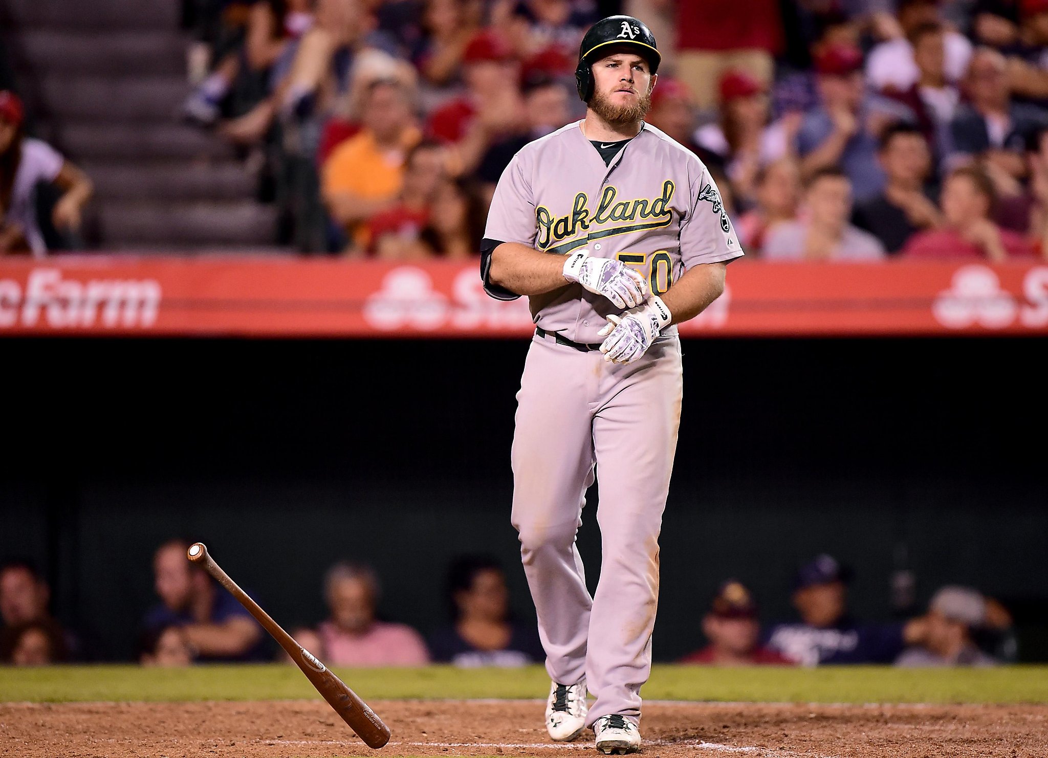 A's cut nine players, including Max Muncy