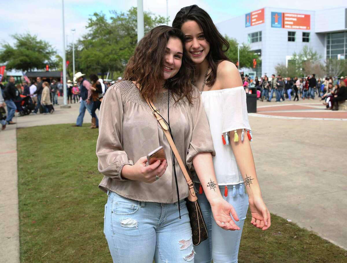 People pose for a photo at Houston Livestock Show and Rodeo Sunday, March 12, 2017, in Houston.