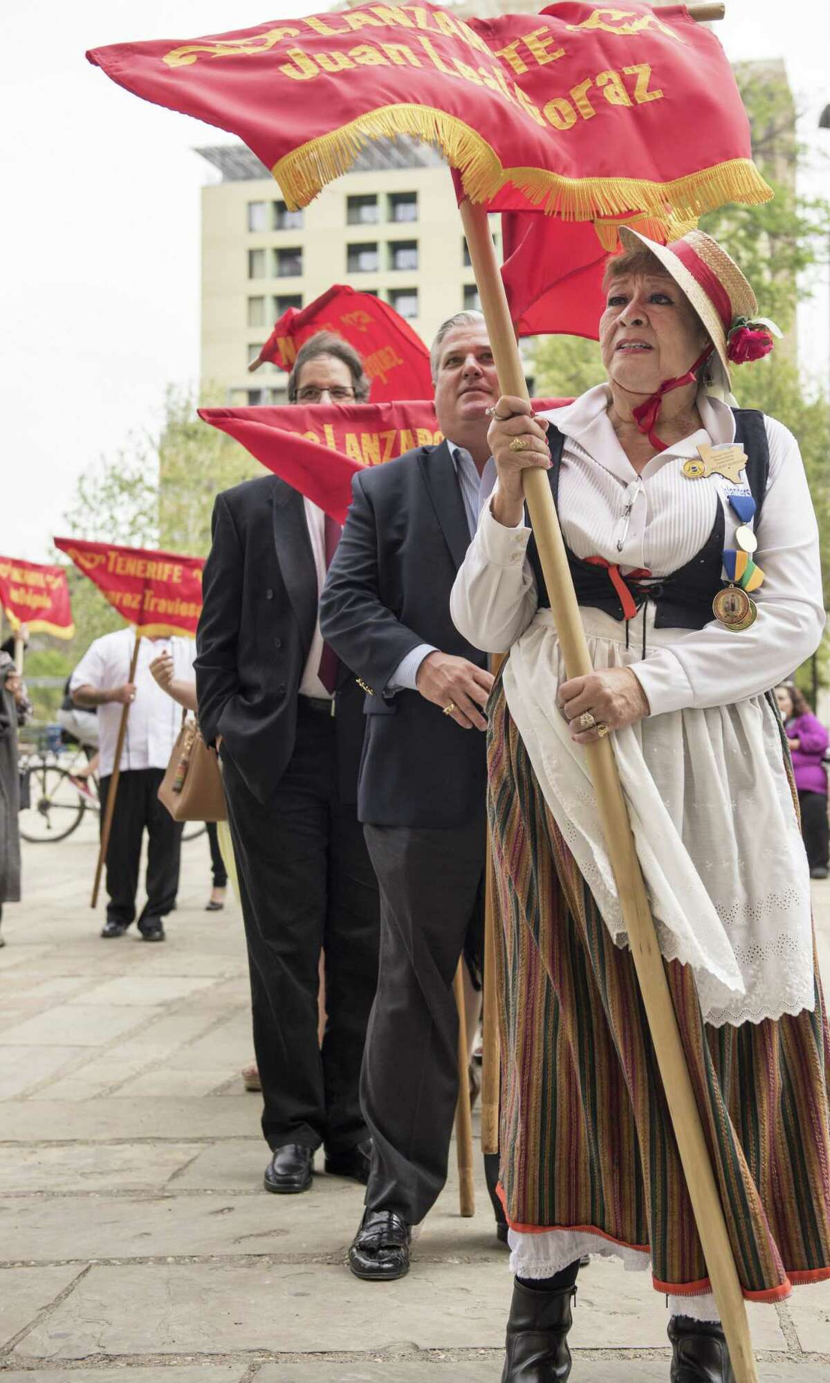 Alicia Calderon a member of Canary Islands Descendants Association commemorates the arrival of their ancestors in San Antonio on Sunday, March 12, 2017, at San Fernando Cathedral. Some members of the association dressed in full historical attire and carry banners representing the original sixteen families who established the first civil government in San Antonio.