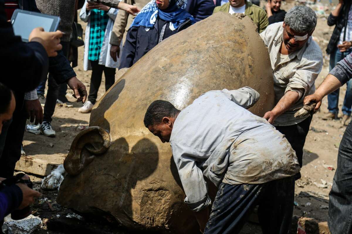 CAIRO, EGYPT - MARCH 8: A quartzite colossus possibly of Ramses II and limestone bust of Seti II are seen after they were discovered at the ancient Heliopolis archaeological site in Matareya area in Cairo, Egypt on March 9, 2017. The statues were found in parts in the vicinity of the King Ramses II temple in the temple precinct of ancient Heliopolis, also known as Oun, by a German-Egyptian archaeological mission. (Photo by Ibrahim Ramadan/Anadolu Agency/Getty Images)