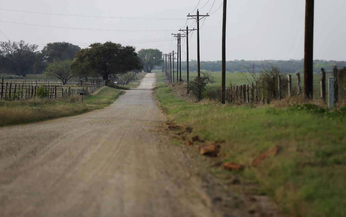 Old Applewhite Road - a gravel road in Atascosa County - divides home owners on the left to land that has been purchased by a company that wants to operate a sand mine to the right on Tuesday, Feb. 28, 2017. The county is known for its loamy sand, good for growing peanuts, other legumes and strawberries. Now residents in Atascosa County are upset about a proposed frac sand mine that could be coming to their community. A Pennsylvania-based mining company about six months ago created an LLC in Texas and has targeted around 1,000 acres for a new mine. A group has organized in protest and so far the TCEQ has received 40 written protests and 163 public hearing requests. Atascosa County Judge Robert Hurley said he has told the mining company he doesn't want them there, but there's not much more the county can do, other than try to make it difficult for the company to run trucks 24 hours per day on its gravel roads. There's also a historic marker near the proposed site commemorating the Battle of Medina, the bloodiest conflict ever on Texas soil, whose precise location a mystery. Around 1,000 died in the early bid for Mexico's independence from Spain. The Republican Army of the North, including Tejanos and American Indians, was defeated by the Spanish Royal Army. The running battle lasted four hours and covered up to 8 miles, though no one has proven the precise location. County residents Jessica Hardy and Russel Wilson, who are among the people living near the proposed sand mine, have organized a local group in trying to fight the permit. (Kin Man Hui/San Antonio Express-News)