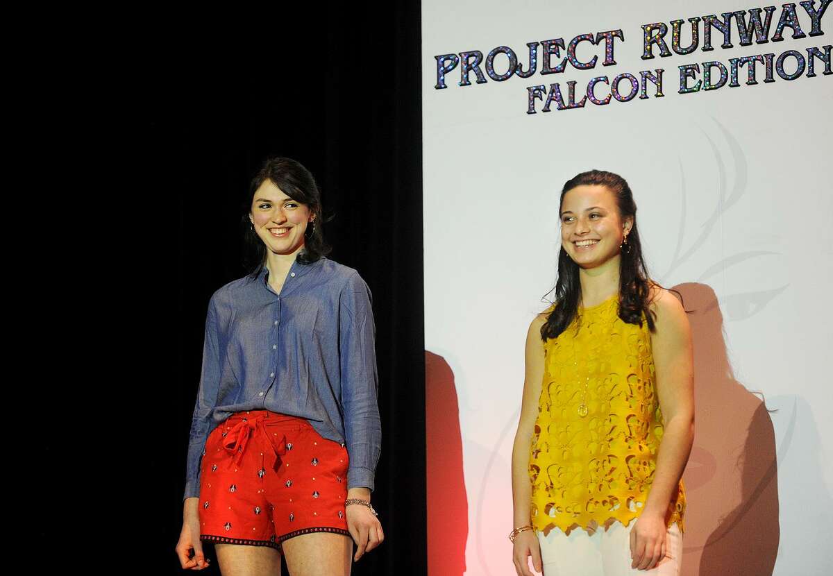 Fairfield Ludlowe High School students Annie Funk, left, and Cassandra Factora are introduced on the runway during the school's 10th Annual Project Runway Falcon Edition fashion show at the school in Fairfield, Conn. on Sunday, March 12, 2017.