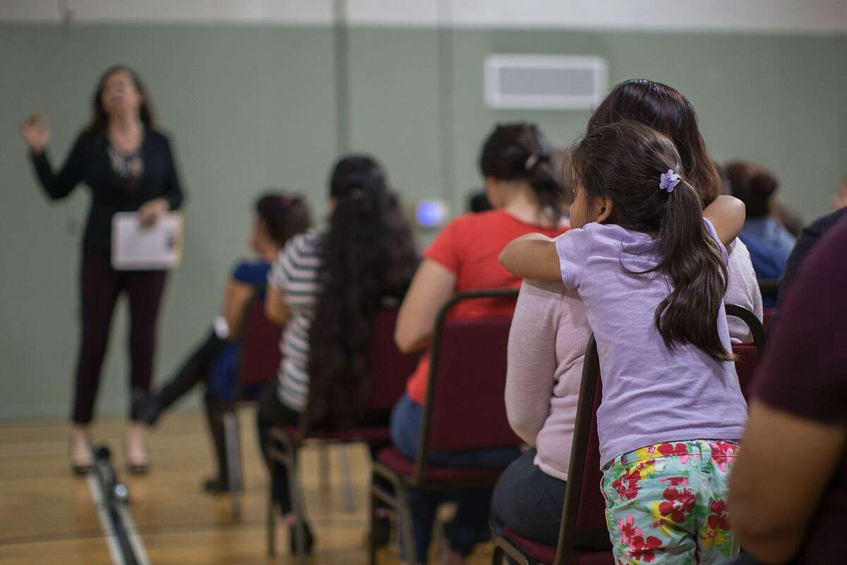 Families take part in a Los Angeles workshop for immigrants to help them prepare in case they are confronted by immigration officials.