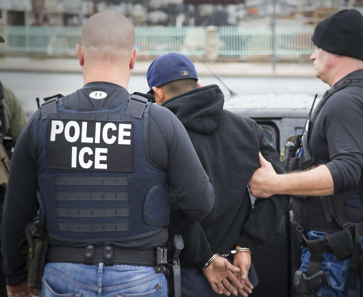 In this Tuesday, Feb. 7, 2017, photo released by U.S. Immigration and Customs Enforcement shows foreign nationals being arrested during a targeted enforcement operation conducted by U.S. Immigration and Customs Enforcement (ICE) aimed at immigration fugitives, re-entrants and at-large criminal aliens in Los Angeles. 