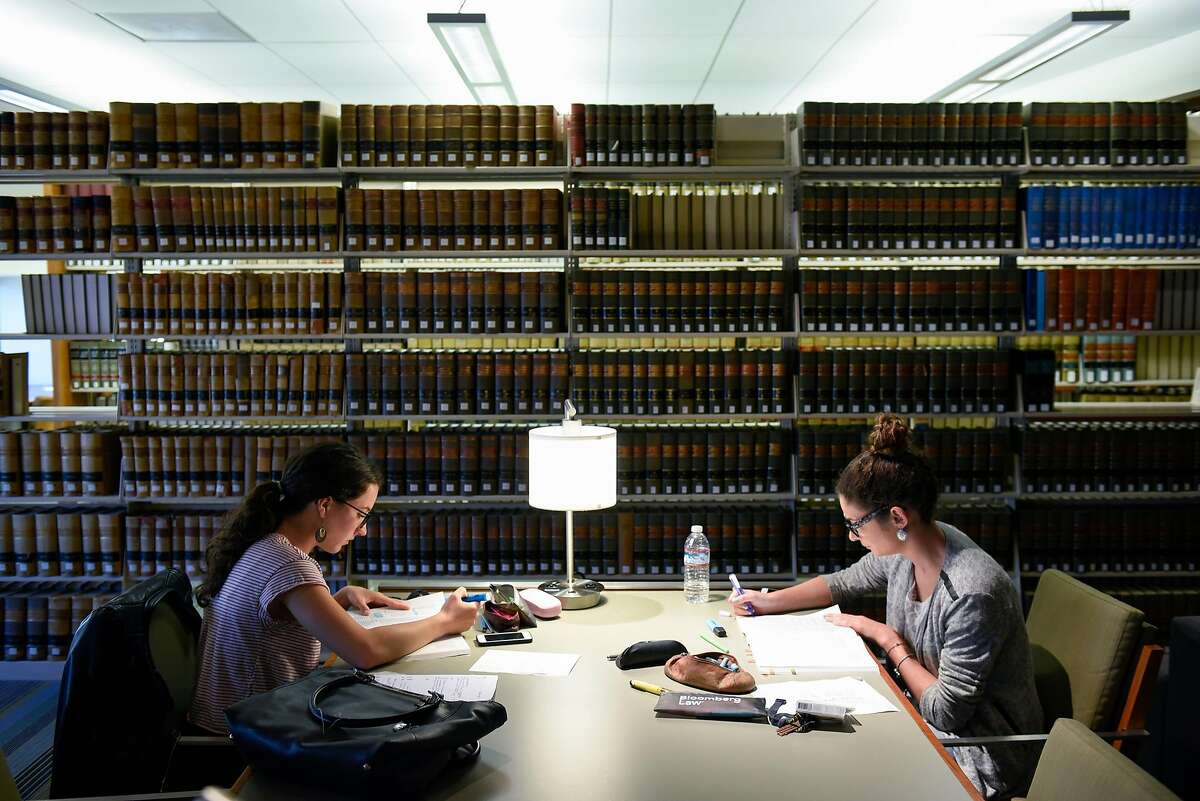 Jeanne Briand, left, and Geraldine Gonzalez studying for the bar exam� in the library at UC Hastings College of the Law in San Francisco, CA, on Monday March 13, 2017. Author Jackie Gardina argues that California should lower its passing score for the bar exam.