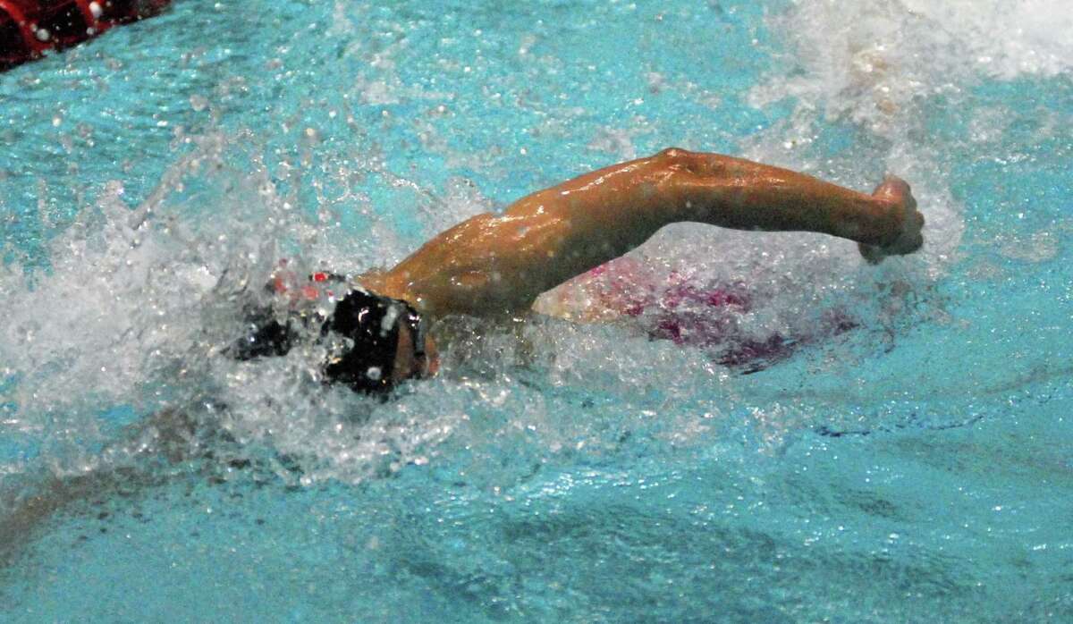 New Canaan's Bhaskar Abhiraman swims in the 200 freestyle at the Class L championships on Monday.
