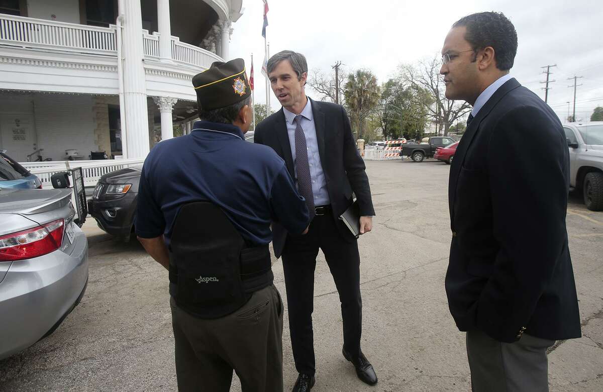 Congressman Beto O'Rourke (D-El Paso) (center) shakes hands Monday March 13, 2017 with Johnny Ornelaz (cq) (left, wearing hat), post commander at VFW Hall 76 as congressman Will Hurd (right) (R-Helotes) looks on. Hurd and O'Rourke visited San Antonio to talk with area veterans about issues affecting the veteran community.