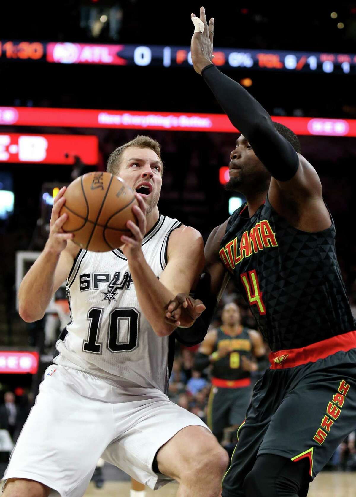 Spurs’ David Lee looks for room inside around the Atlanta Hawks’ Paul Millsap during first half action on March 13, 2017 at the AT&T Center.