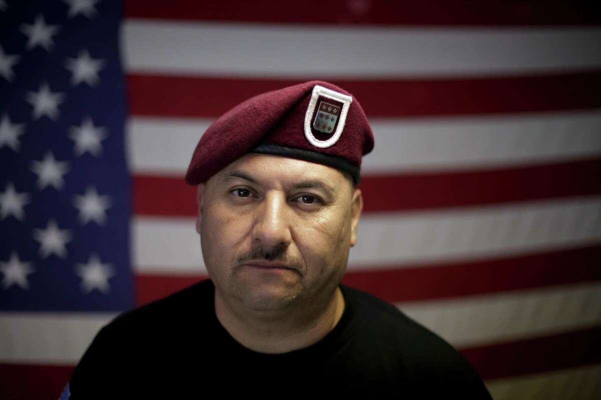 In this Feb. 13, 2017 photo, U.S. Army veteran Hector Barajas, who was deported, poses for a portrait in his office at the Deported Veterans Support House, nicknamed "the bunker" in Tijuana, Mexico. Despite the pain of separation, many deported vets say they wouldn't hesitate to serve again if given the chance. "Where do I sign up?" said Barajas. (AP Photo/Gregory Bull)