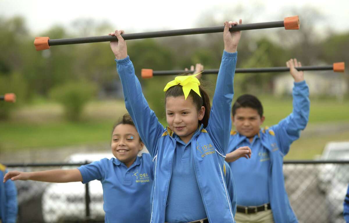 Megan Flores works with a weight bar iduring third and fourth grade physical education class at IDEA Monterrey Park on Friday, March 3, 2017. The "Healthy Kids Here" initiative aims to encourage students to achieve and maintain good health.