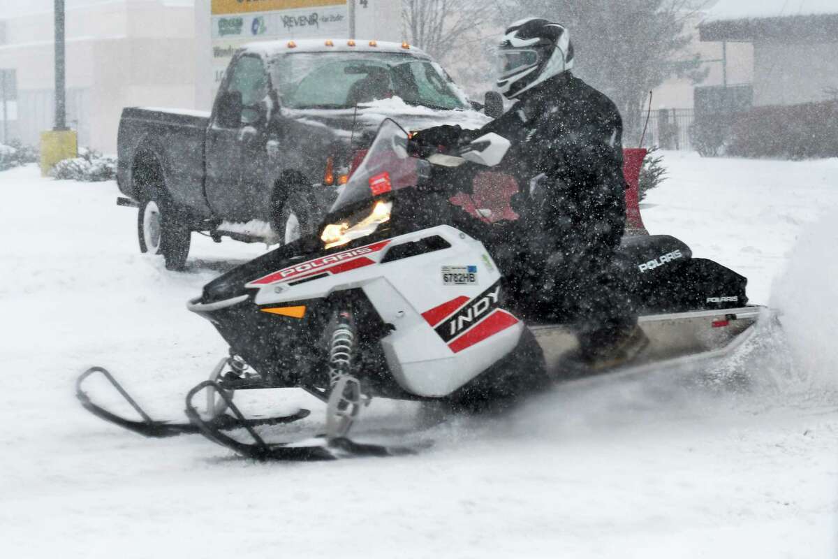 A snow mobile rider makes his way down Central Avenue as winter storm Stella @NWS #StellaBlizzard hits the Capital Region Tuesday March 14, 2017 in Colonie, NY. (John Carl D'Annibale / Times Union)