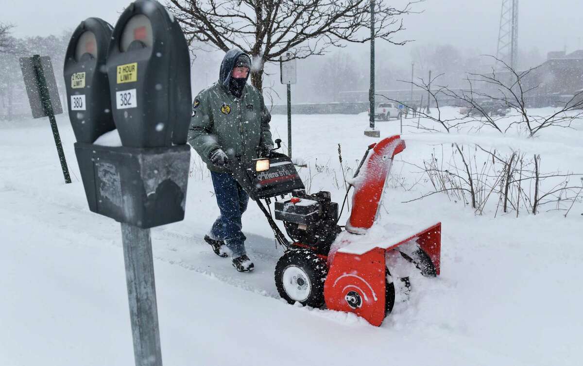 County employee Chris Kremzier snow blows the sidewalks around the Schenectady Public Library as winter storm Stella @NWS #StellaBlizzard hits on Central Avenue Tuesday March 14, 2017 in Schenectady, NY. (John Carl D'Annibale / Times Union)