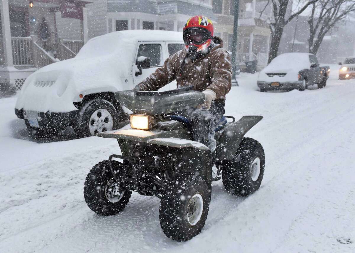 March 14, 2017: His car snowbound, Tom Padden of Schenectady uses his ATV to get to work as a winter snowstorm hits on Central Avenue Tuesday March 14, 2017 in Schenectady, NY. (John Carl D'Annibale / Times Union)