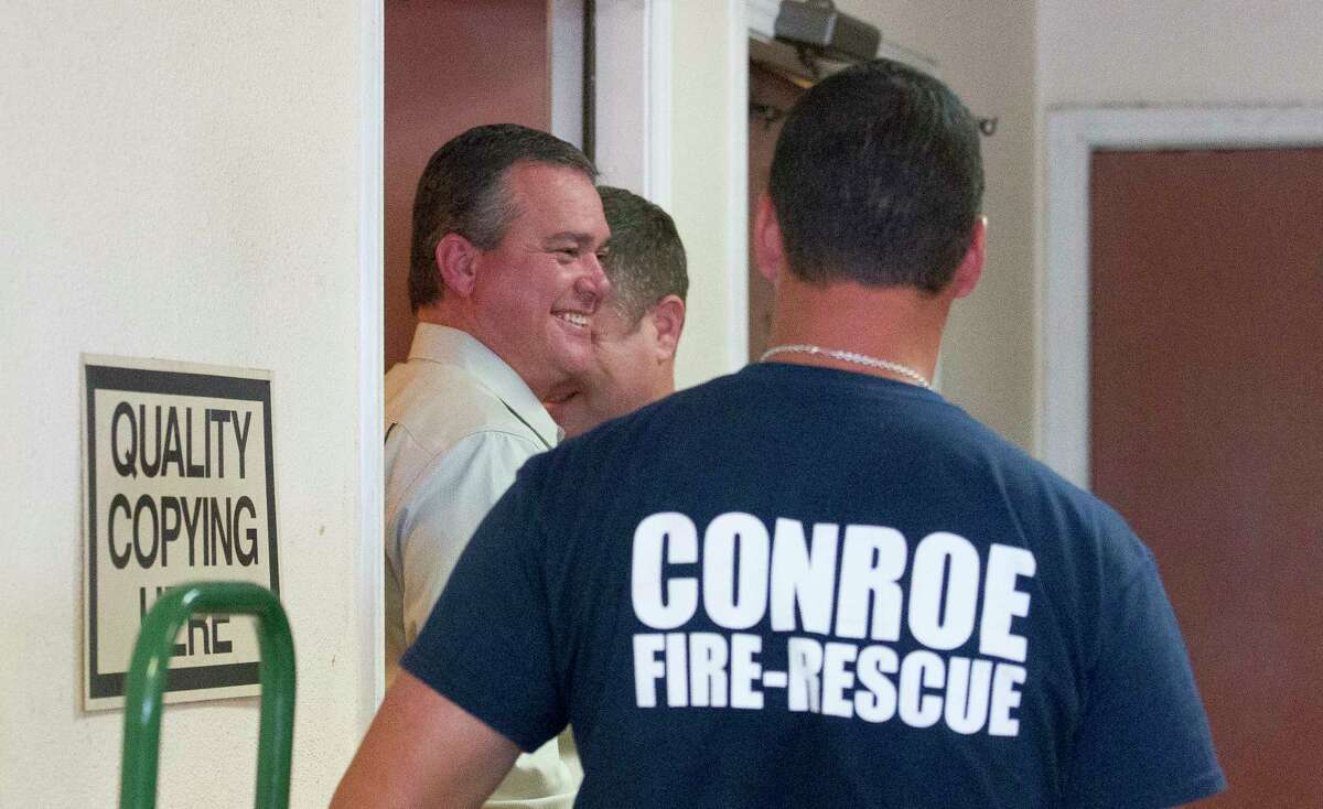 Conroe City Council member Duane Ham smiles after firefighters with the Conroe Fire Department freed him from a locked unisex bathroom at Super Z Food Market on Tuesday, March 14, 2017, in Conroe.