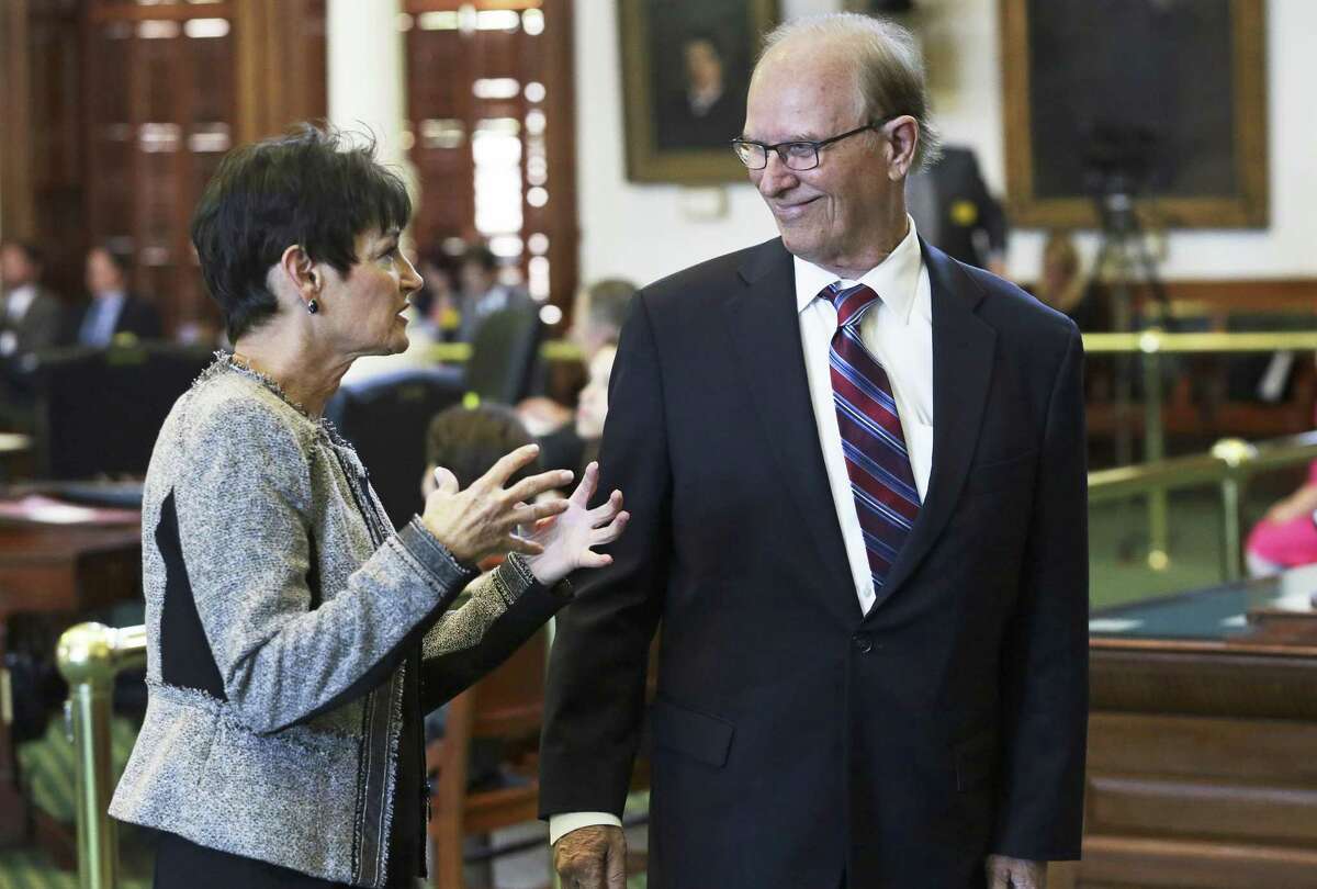 Sen. Donna Campbell chats with Bexar County Judge Nelson Wolff. “Keep driving a little further,” Wolff said of the measure.