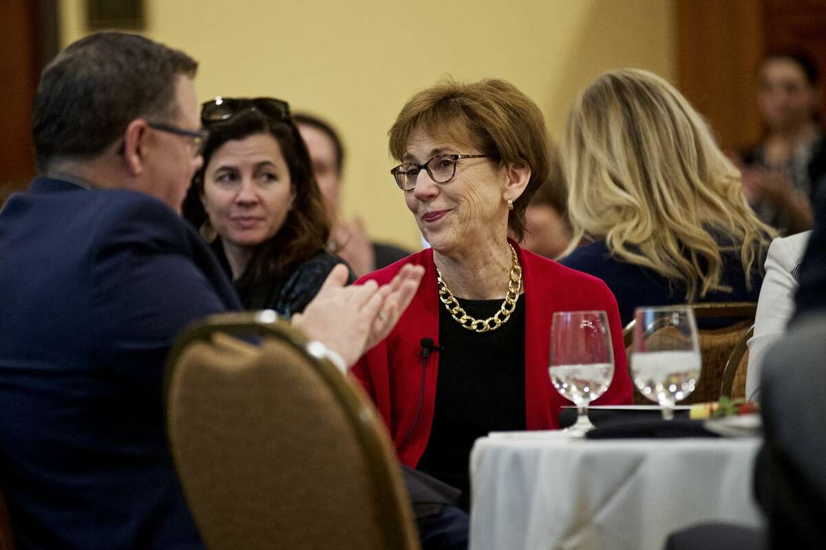 Midland Mayor Maureen Donker smiles while being introduced and noted for her upcoming YWCA Great Lakes Bay Region Lifetime Achievement Award before delivering her State of the City address on Wednesday at the Holiday Inn Conference Center.