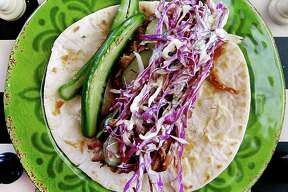 Week 11 Taco of the Week: El Purple Rain taco with barbecue pork, slaw and serranos at Sabinas Coffee House.