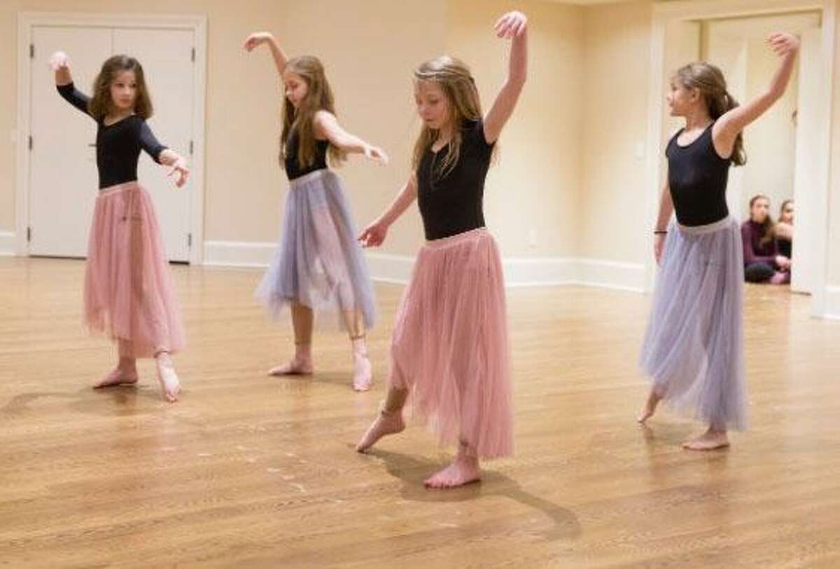 Students in Studio D’s choreography class, including Ruby Latta, Anna MacDonnell, Avery Rubini and Katelyn Brunner, perform their own choreography during a recent performance.