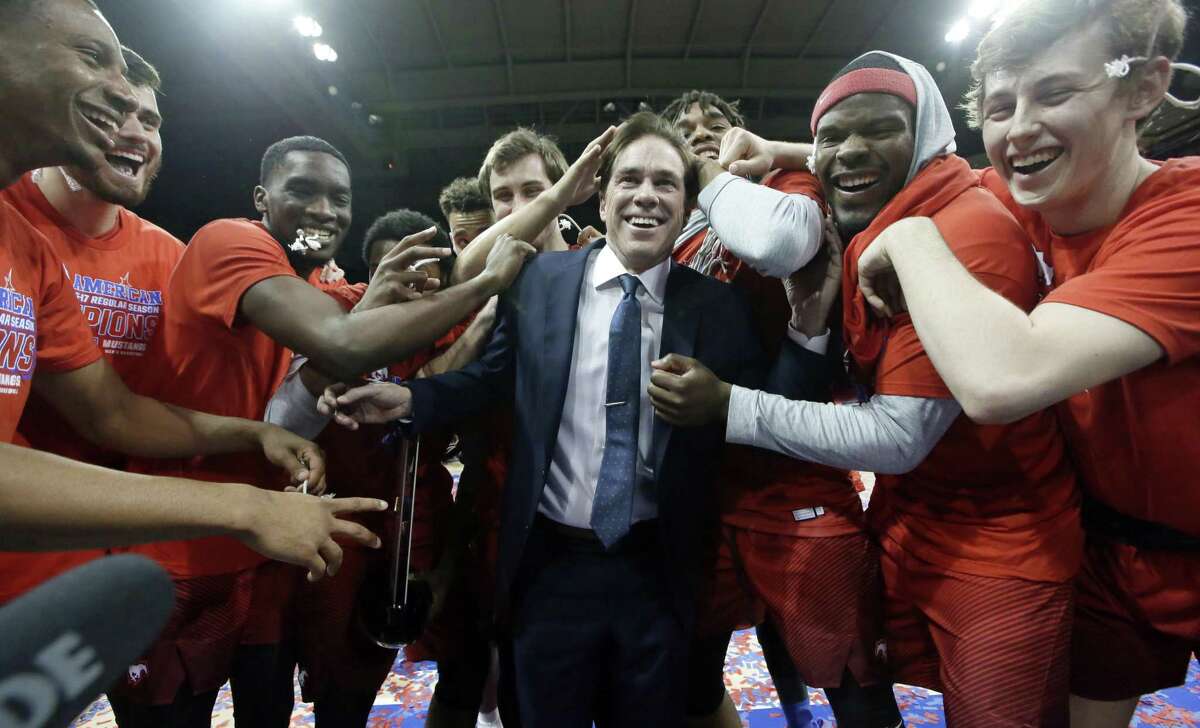 SMU coach Tim Jankovich celebrates with his players after defeating Memphis 103-62 in the American Athletic conference final in Dallas on March 4, 2017. Jankovich isn’t going to complain about a No. 6 seed for the AAC champion with a 16-game winning streak. After being banned from last year’s NCAA college basketball tournament despite 25 wins, the Mustangs are happy to be back in the 68-team NCAA field