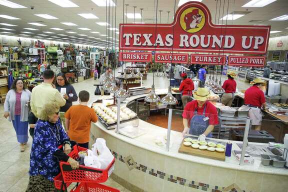 Shoppers look at the barbecue station at the Buc-ee's in Baytown Thursday, March 10, 2016 in Houston. The mega convenience store chain has announced it will open a location in Baton Rouge, Louisiana, their first location outside Texas. ( Michael Ciaglo / Houston Chronicle )