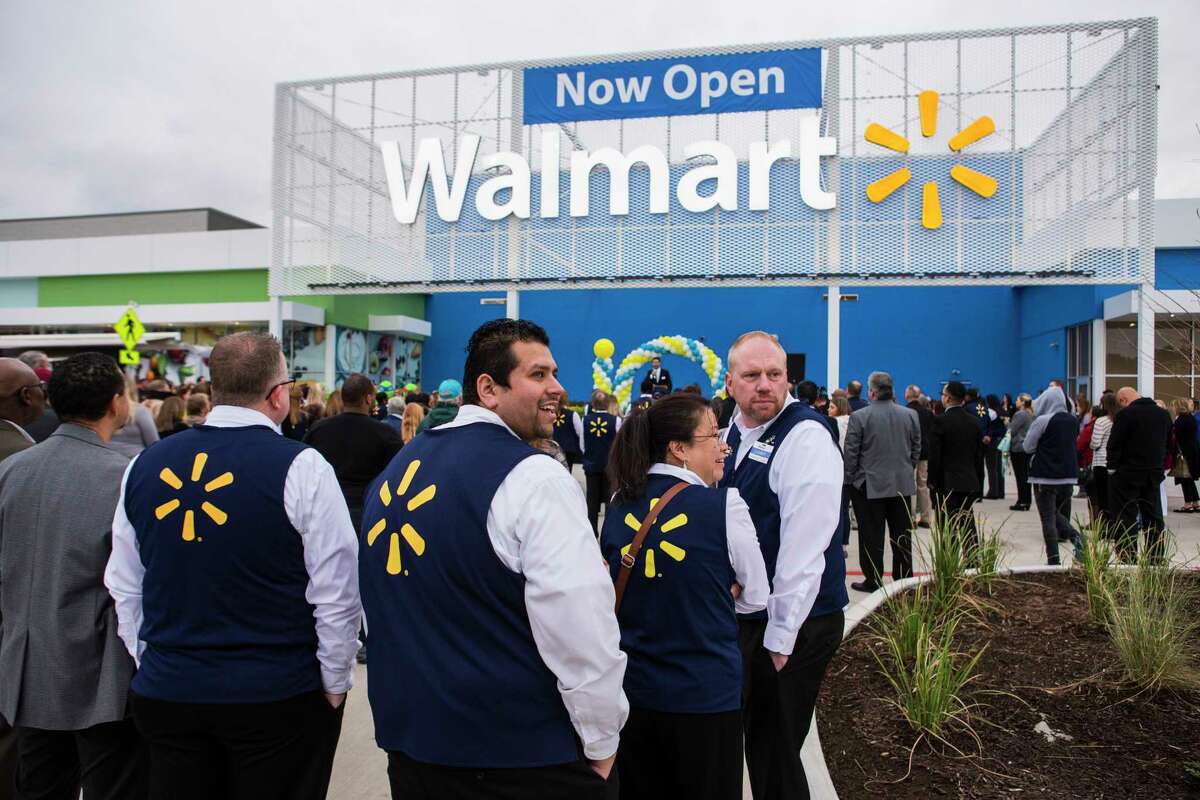 Wal-Mart associates stand outside the store for the grand opening ceremony of the new Wal-Mart on Wednesday, Feb. 15, 2017, in Tomball. ( Brett Coomer / Houston Chronicle )