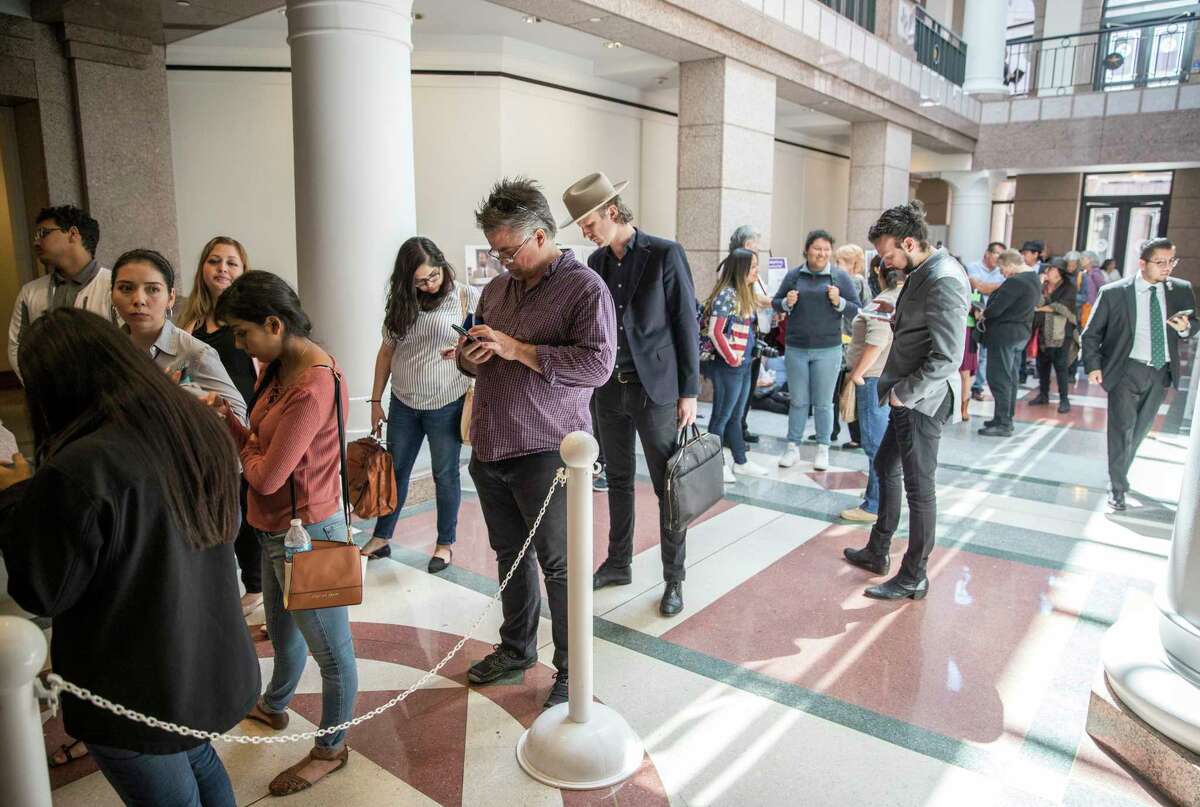 A large group of people wait in line to attend the "sanctuary cities" meeting at the Texas State Capitol in Austin on Wednesday. Action on the bill is likely to take awhile.