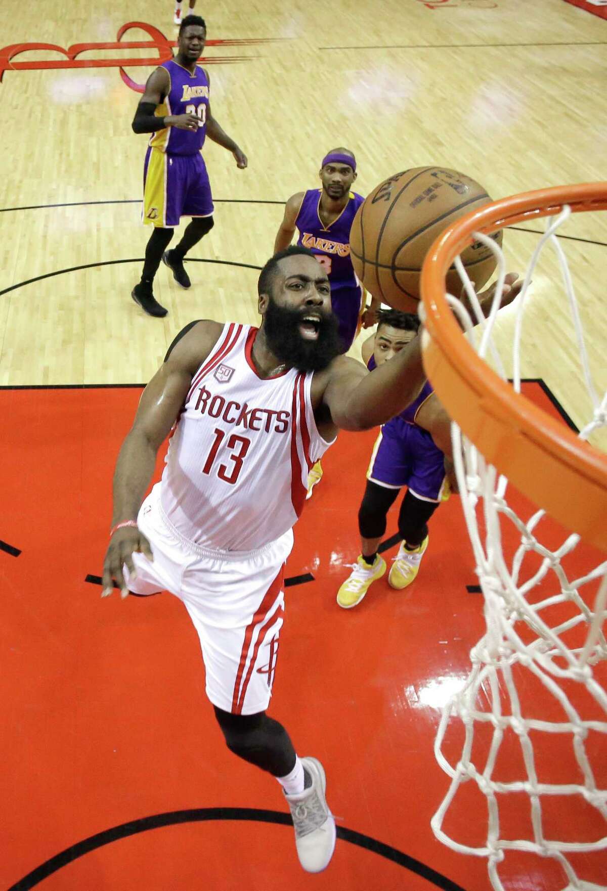 Houston Rockets' James Harden (13) goes up for a shot against the Los Angeles Lakers during the first half of an NBA basketball game Wednesday, March 15, 2017, in Houston. (AP Photo/David J. Phillip)