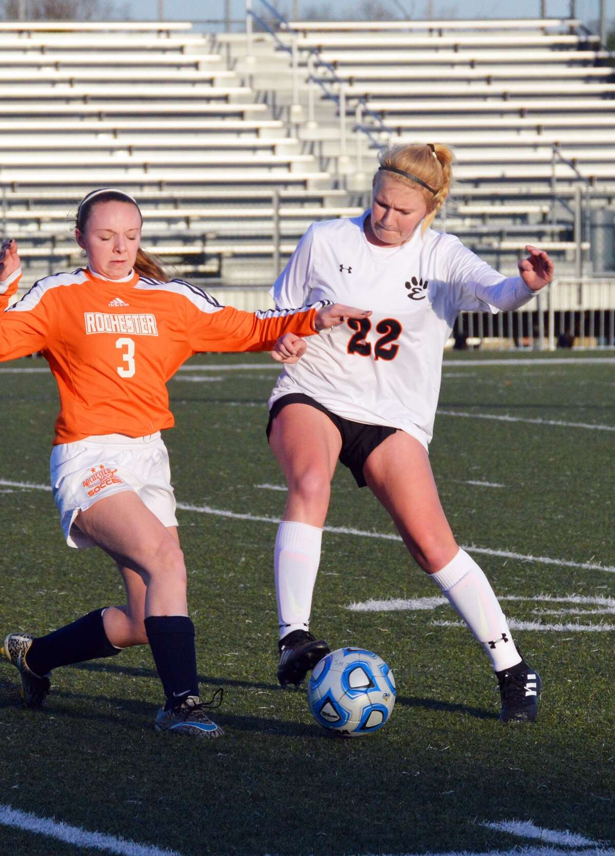 Edwardsville senior defender Taylor Hansen, right, takes the ball away from Rochester’s Katie Cochran in the first half.