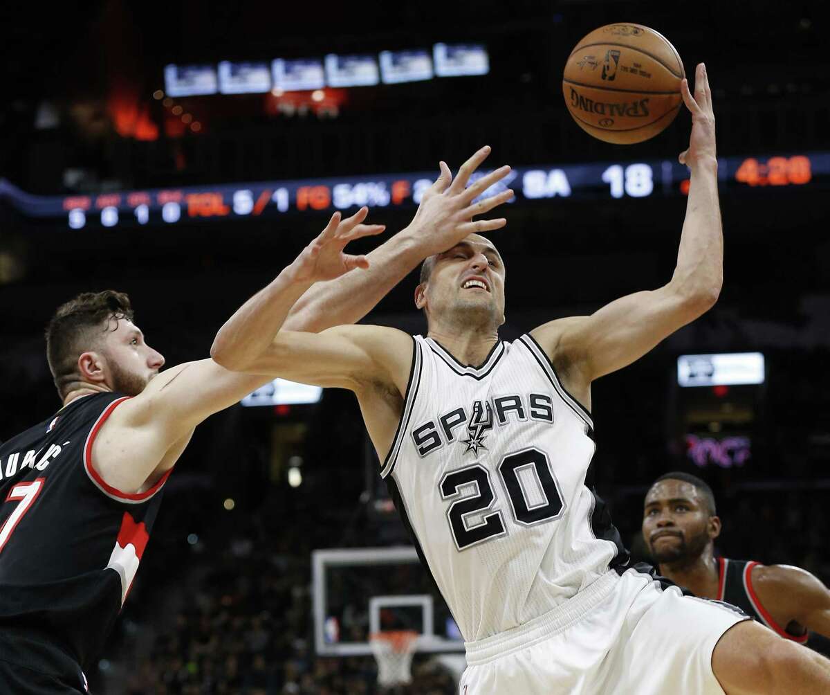 Spurs’ Manu Ginobili steals the ball from Portland’s Jusuf Nurkic (left) at the AT&T Center on March 15, 2017.