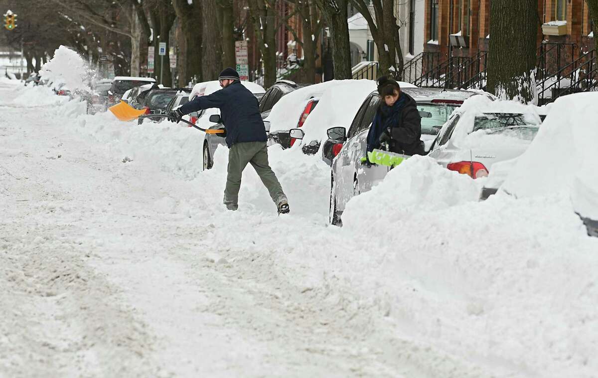 People shovel their cars out on Chestnut St. from yesterday's snow storm on Wednesday, March 15, 2017 in Albany, N.Y. (Lori Van Buren / Times Union)