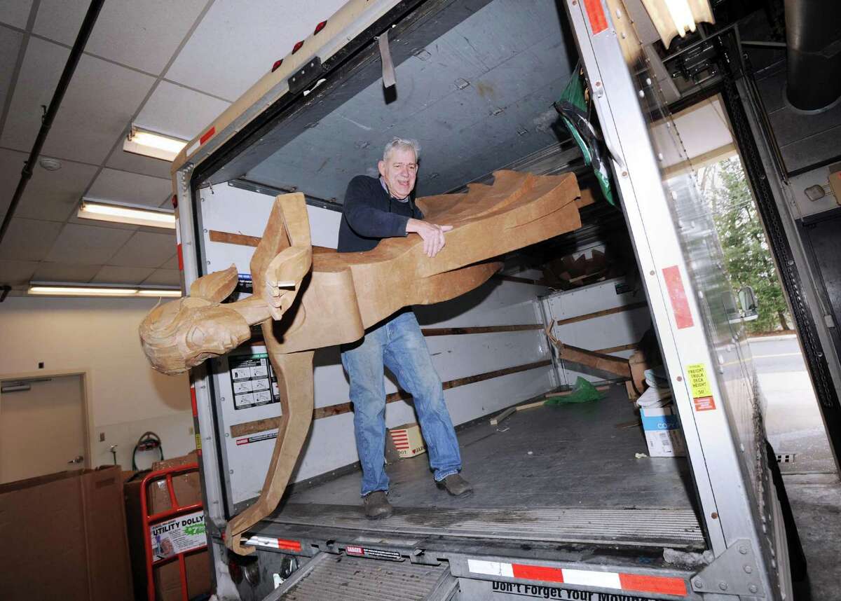Redding artist James Grashow unloads a corrugated board sculpture from a truck for an installation of artworks for his upcoming show titled, Corrugated World: The Art of James Grashow, at the Flinn Gallery located on the second floor of Greenwich Library, Conn., Saturday, March 11, 2017. The show opens on March 16 and runs through April 26. Grashow is renowned for his corrugated board sculptures.
