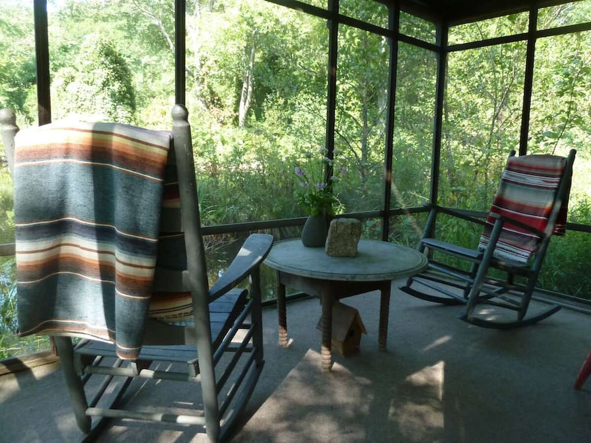 River houseboat, Newtown $99 a night Description: Our rustic River Houseboat is on the edge of the Pootatuck River on our lower pond. The Houseboat has a comfy queen bed and a screened porch complete with two antique rocking chairs. The River Houseboat is often preferred because it is located close to the main Stone Barn and parking lot. The Stone Barn is open 24 hours and has a hot shower, toilet, and common room with internet and books. View full listing on Airbnb