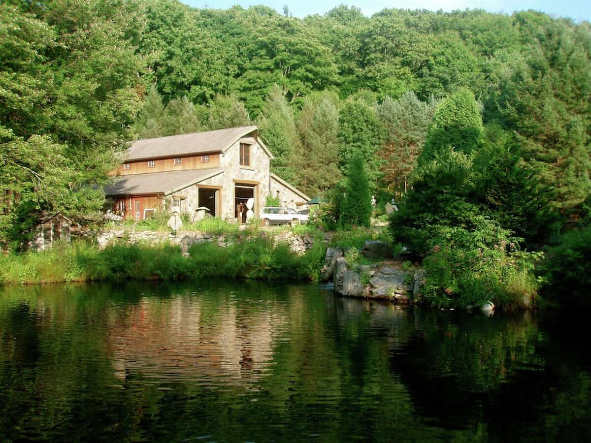 River houseboat, Newtown $99 a night Description: Our rustic River Houseboat is on the edge of the Pootatuck River on our lower pond. The Houseboat has a comfy queen bed and a screened porch complete with two antique rocking chairs. The River Houseboat is often preferred because it is located close to the main Stone Barn and parking lot. The Stone Barn is open 24 hours and has a hot shower, toilet, and common room with internet and books. View full listing on Airbnb
