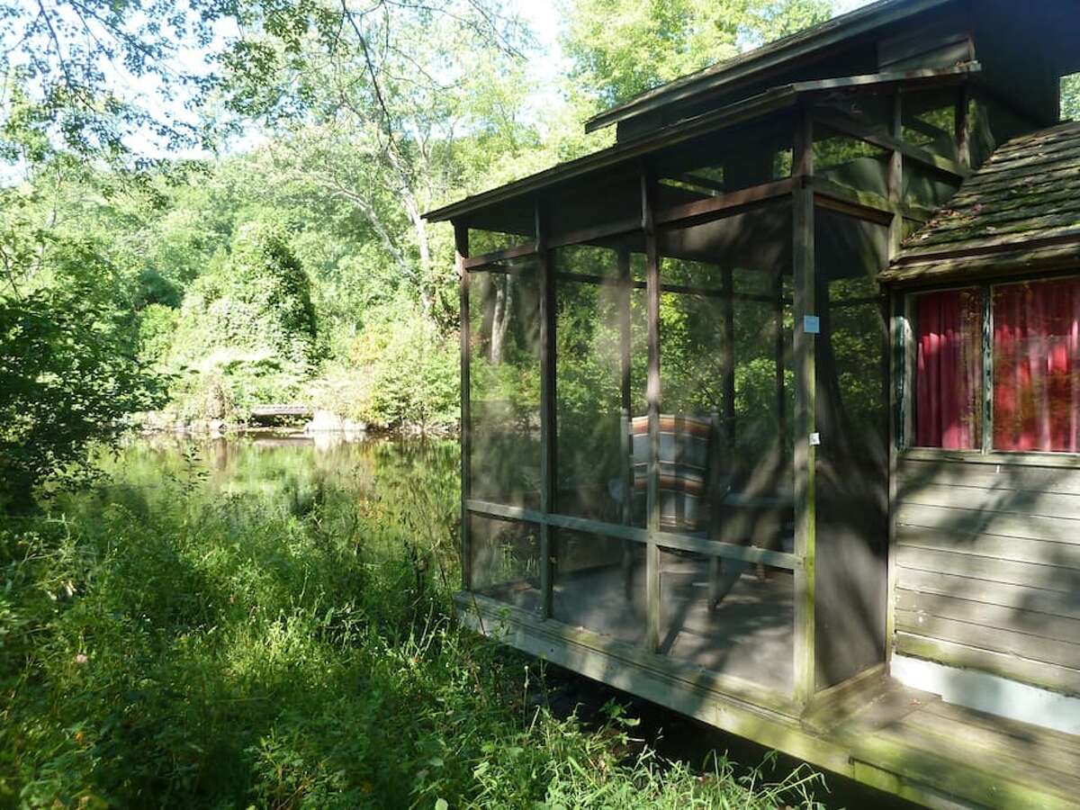 River houseboat, Newtown $99 a night Description: Our rustic River Houseboat is on the edge of the Pootatuck River on our lower pond. The Houseboat has a comfy queen bed and a screened porch complete with two antique rocking chairs. The River Houseboat is often preferred because it is located close to the main Stone Barn and parking lot. The Stone Barn is open 24 hours and has a hot shower, toilet, and common room with internet and books. View full listing on Airbnb