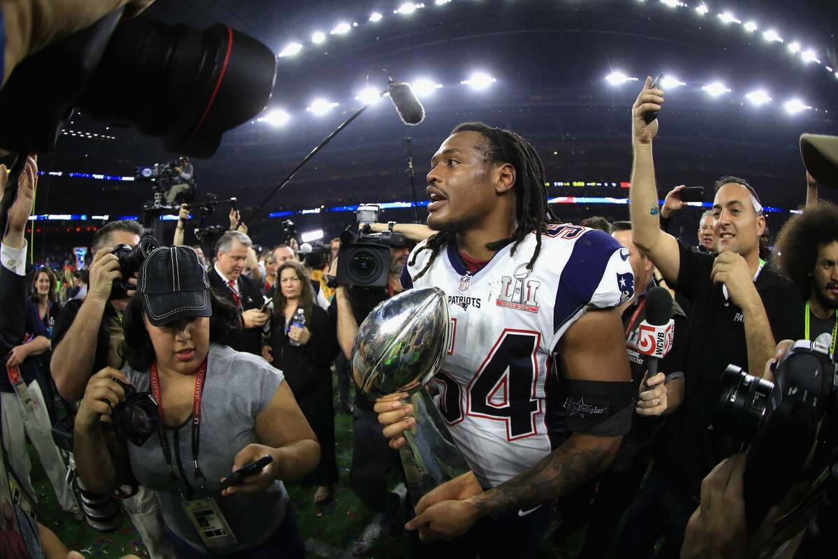 HOUSTON, TX - FEBRUARY 05: Dont'a Hightower #54 of the New England Patriots holds the Vince Lombardi Trophy after defeating the Atlanta Falcons 34-28 in overtime during Super Bowl 51 at NRG Stadium on February 5, 2017 in Houston, Texas. (Photo by Mike Ehrmann/Getty Images)