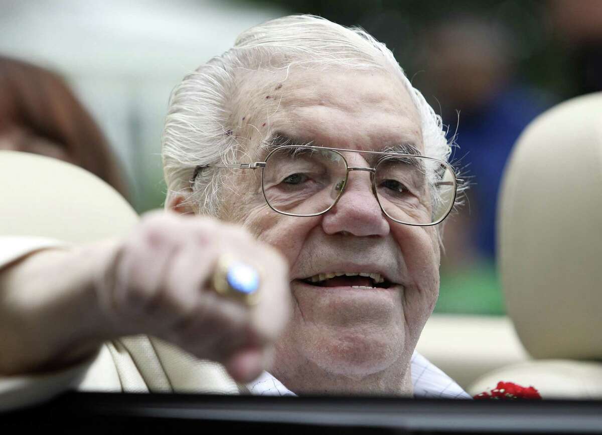 Lou Duva gestures at the Boxing Hall of Fame parade in Canastota, N.Y., on June 12, 2011. The Boxing Hall of Famer trainer, who handled the careers of 19 champions including heavyweight titlist Evander Holyfield, died March 8, 2017, of of natural causes.