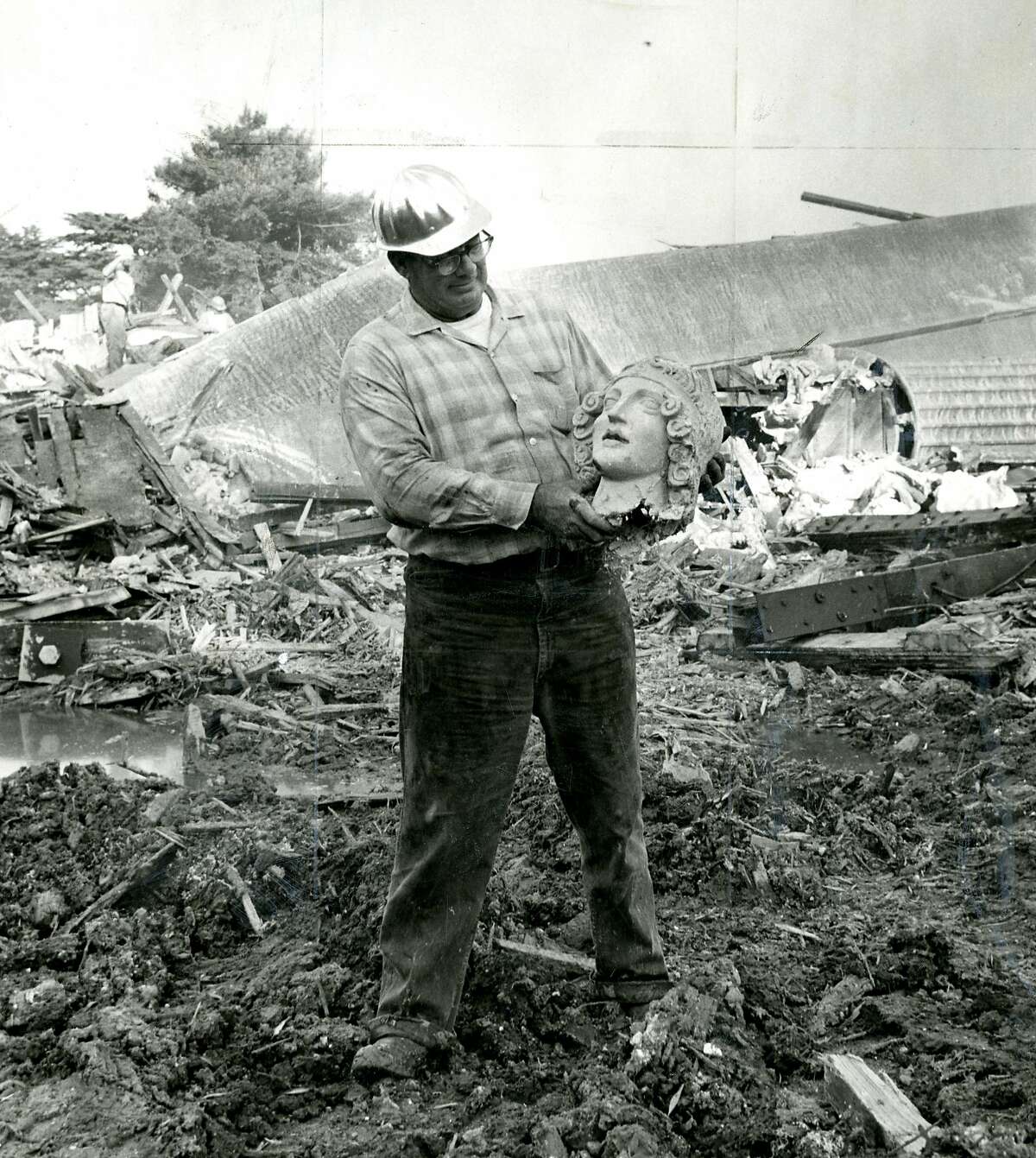 Dick Laws, wrecking foreman with "souvenir" from the San Francisco Palace of Fine Arts reconstruction. November 8, 1964