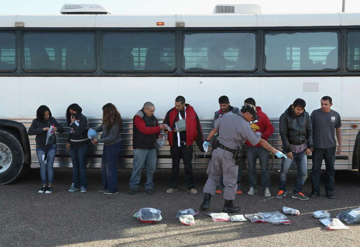 Immigrants collect their belongings before being deported across an international bridge into Mexico on March 14, 2017, from Hidalgo, Texas. The U.S. Border Patrol has reported that illegal crossings from Mexico have dropped some 40 percent along the southwest border since Trump took office.